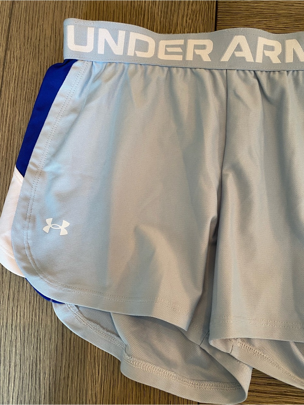 Under Armour Light Gray Athletic Men's Shorts with Blue Accent